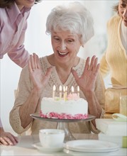 Senior woman celebrating birthday.