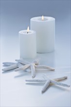Starfish and candles. Photographe : Daniel Grill
