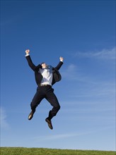 Businessman jumping air.
