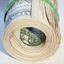 Close up of roll of cash. Photographe : Jamie Grill