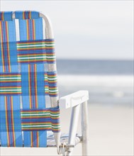Beach chair on beach. Photographe : Jamie Grill