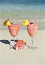 Tropical drinks on beach.