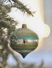 Close up of snow covered Christmas ornament.