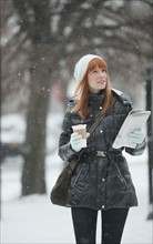 Woman walking in snow.