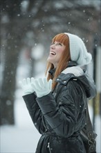 Woman enjoying snow.
