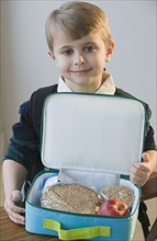 Boy with lunch box.