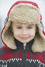 Boy wearing winter hat.
