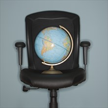 Globe on office chair.