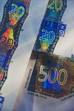 Close up of euro note holograph.