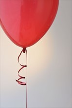 Red balloon and ribbon.
