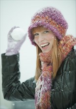 Woman throwing snowball.