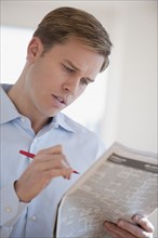 Man reading job listings.
