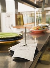 Food order spike in restaurant kitchen.