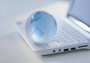 Globe on laptop keyboard.