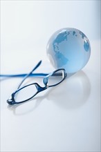 Eyeglasses and globe.