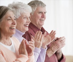 Senior adults clapping.
