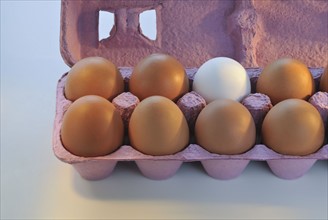 Brown and white eggs.