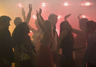 People dancing in nightclub.