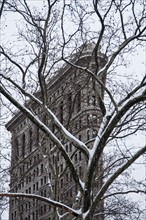 Flatiron Building exterior in winter, New York City, New York, USA. Photographe : Daniel Grill
