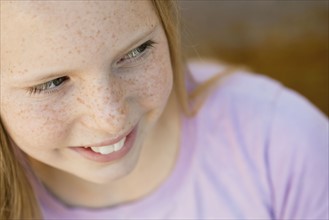 Close-up of smiling girl (10-12). Photographe : Sarah M. Golonka