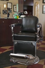 Empty chair in barber shop. Photographe : Sarah M. Golonka