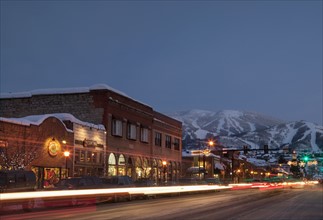 Steamboat Springs, Town at night with mountains in background, Steamboat Springs, Colorado, Use.