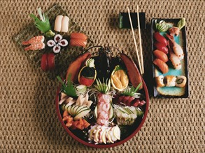 spread of sushi, sashimi &  rolls