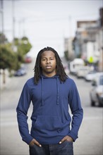 Portrait of teenage boy (16-17) walking in street, San Francisco, California, USA. Photographe : PT