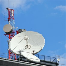 Microwave tower with satellite dish, New York City, New York, USA.