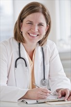 Portrait of female doctor in office.
