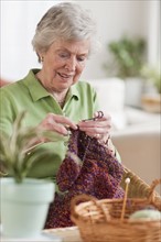 Senior woman knitting.