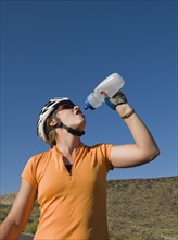 Biker drinking water