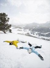 A couple outdoors in the snow