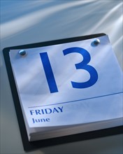 A calender showing Friday the thirteenth.