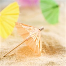 Drink umbrellas on sand