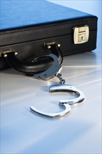 Hand cuffs attached to a suitcase