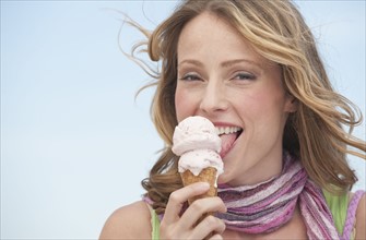 A woman eating ice cream.