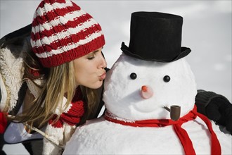 A woman with a snowman