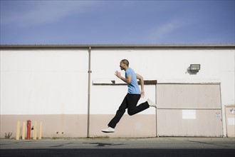 A man jumping on a road