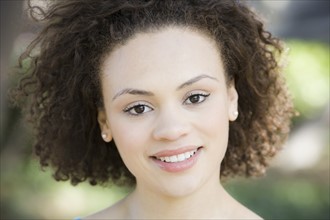 A woman outdoors smiling