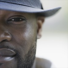 A man outdoors wearing a hat