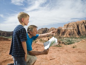 A father and son at Red Rock with a map