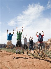 A father with kids at Red Rock jumping