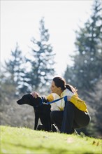 A woman with a dog outdoors