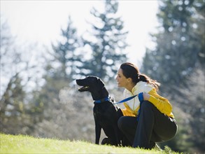 A woman with a dog outdoors