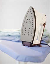 An iron on a ironing board