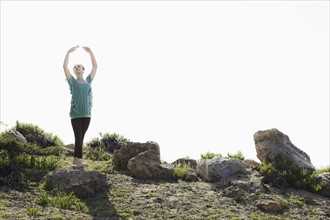 A woman dancing outdoors