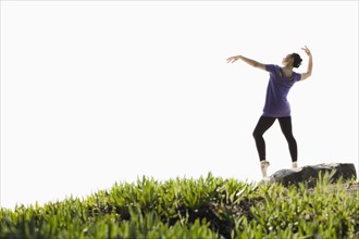 A woman dancing outdoors