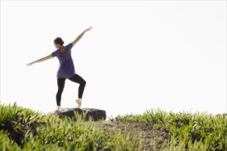 A woman dancing outdoors