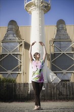 A woman dancing outdoors